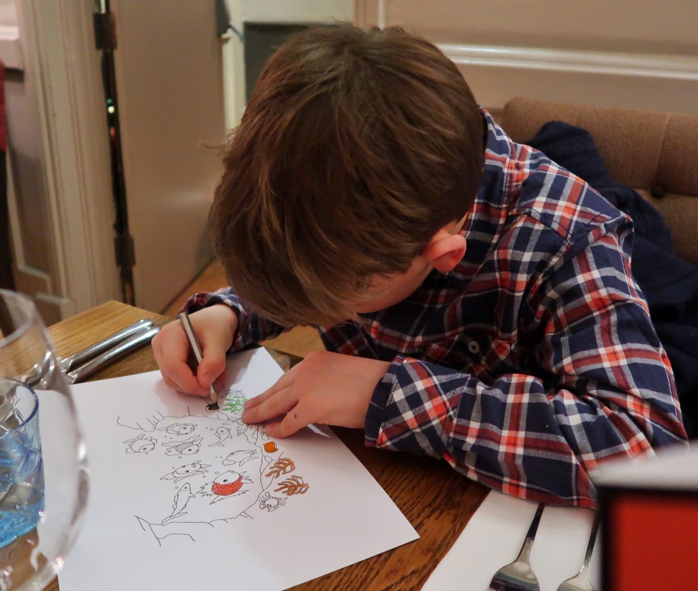 Some very careful colouring in going on on the children's menu at The Feathers Hotel.
