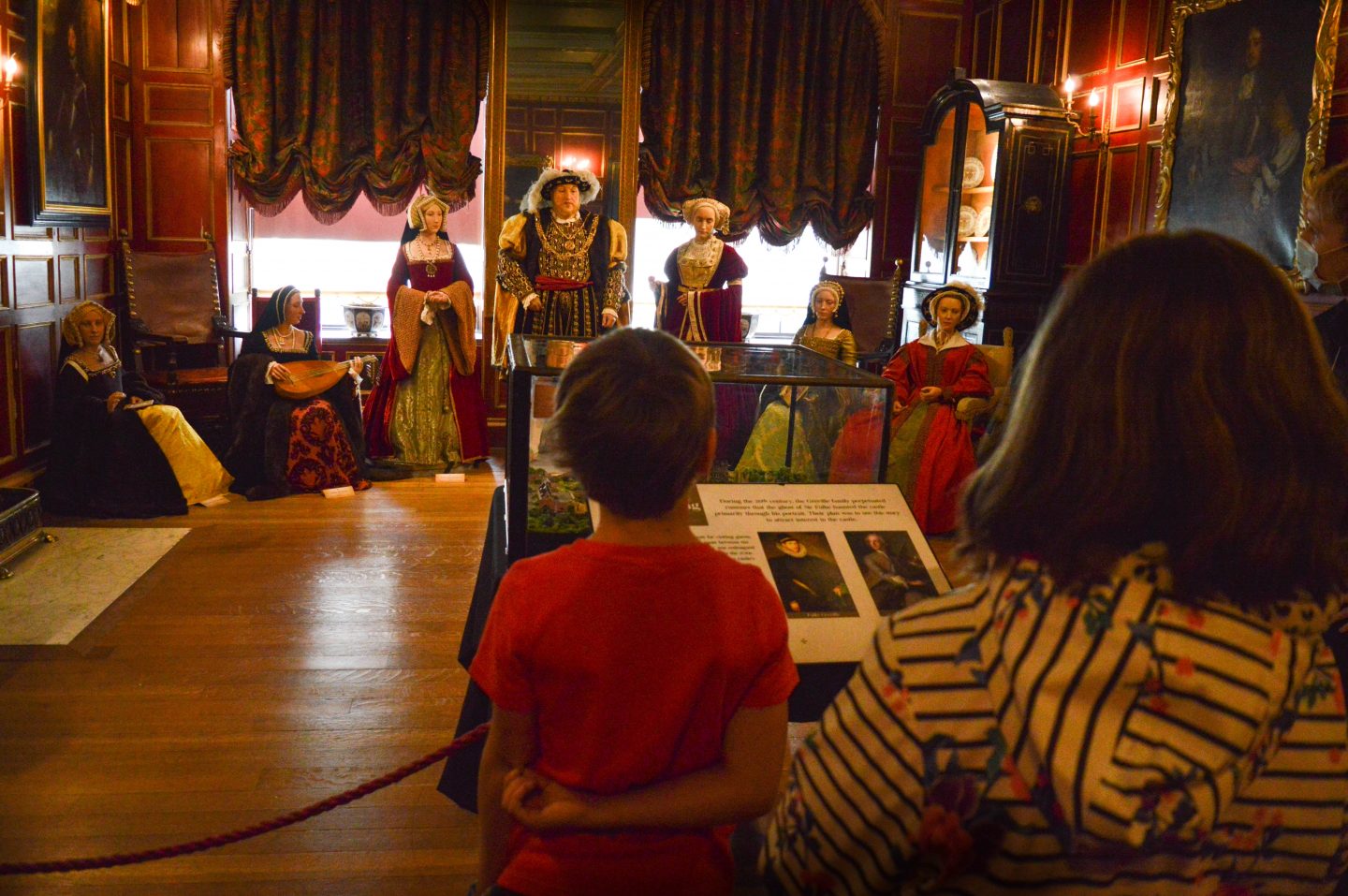 The children stand in front of a display of waxworks at the Castle.